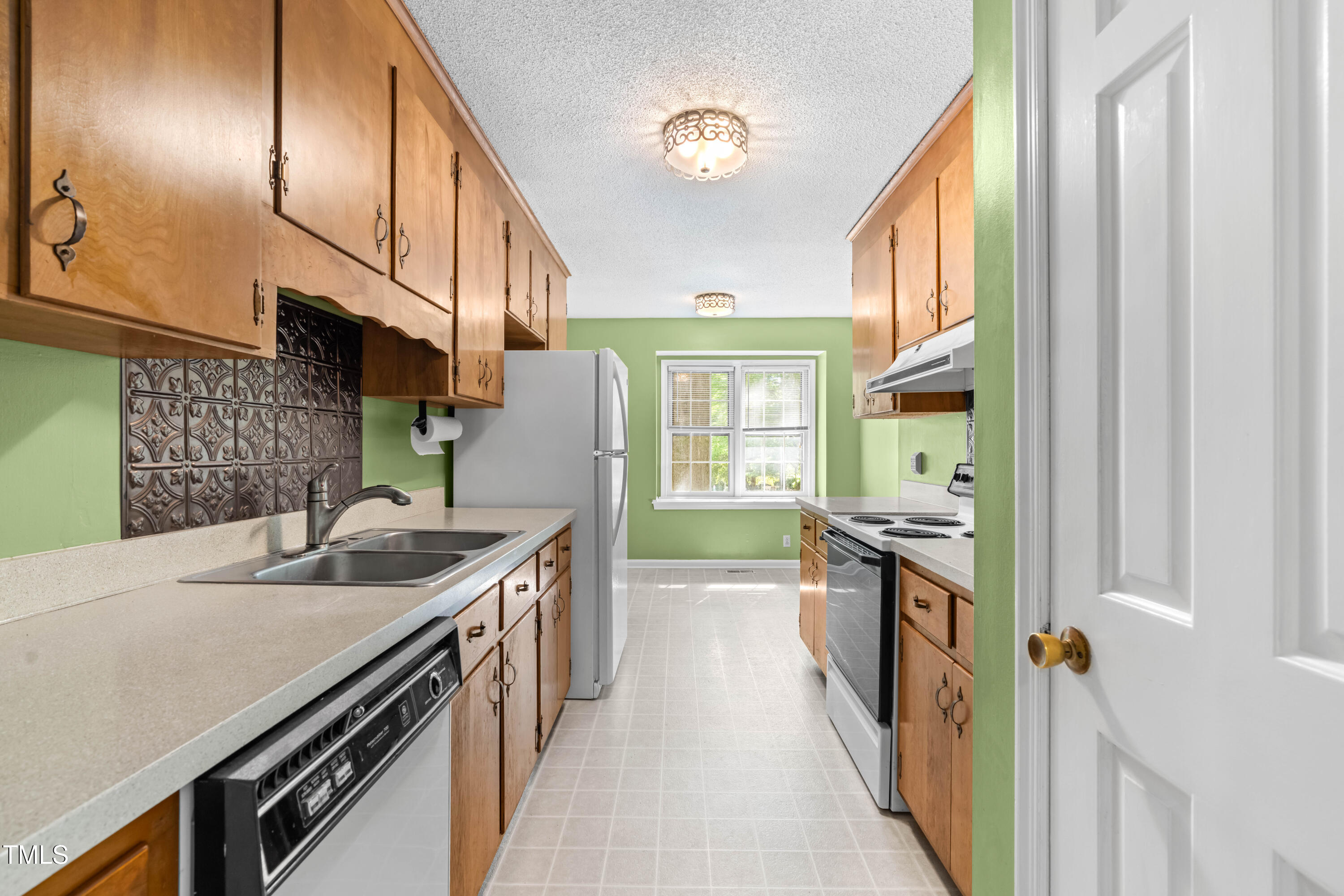 3029 Wycliff Road Raleigh, NC 27607 - Photo 16 of 35 a kitchen with stainless steel appliances granite countertop a sink and a stove