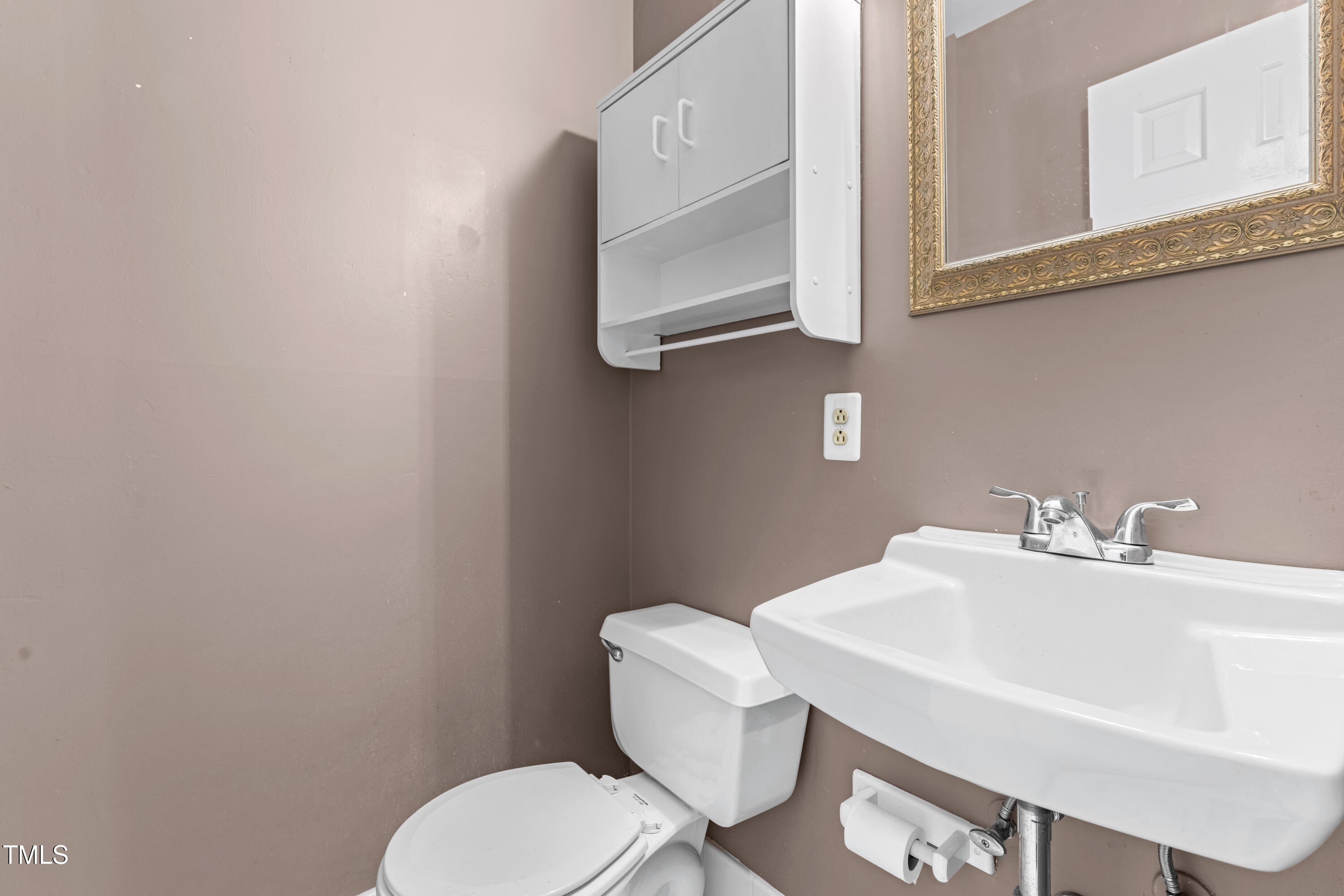 3029 Wycliff Road Raleigh, NC 27607 - Photo 17 of 35 a bathroom with a toilet a sink and mirror