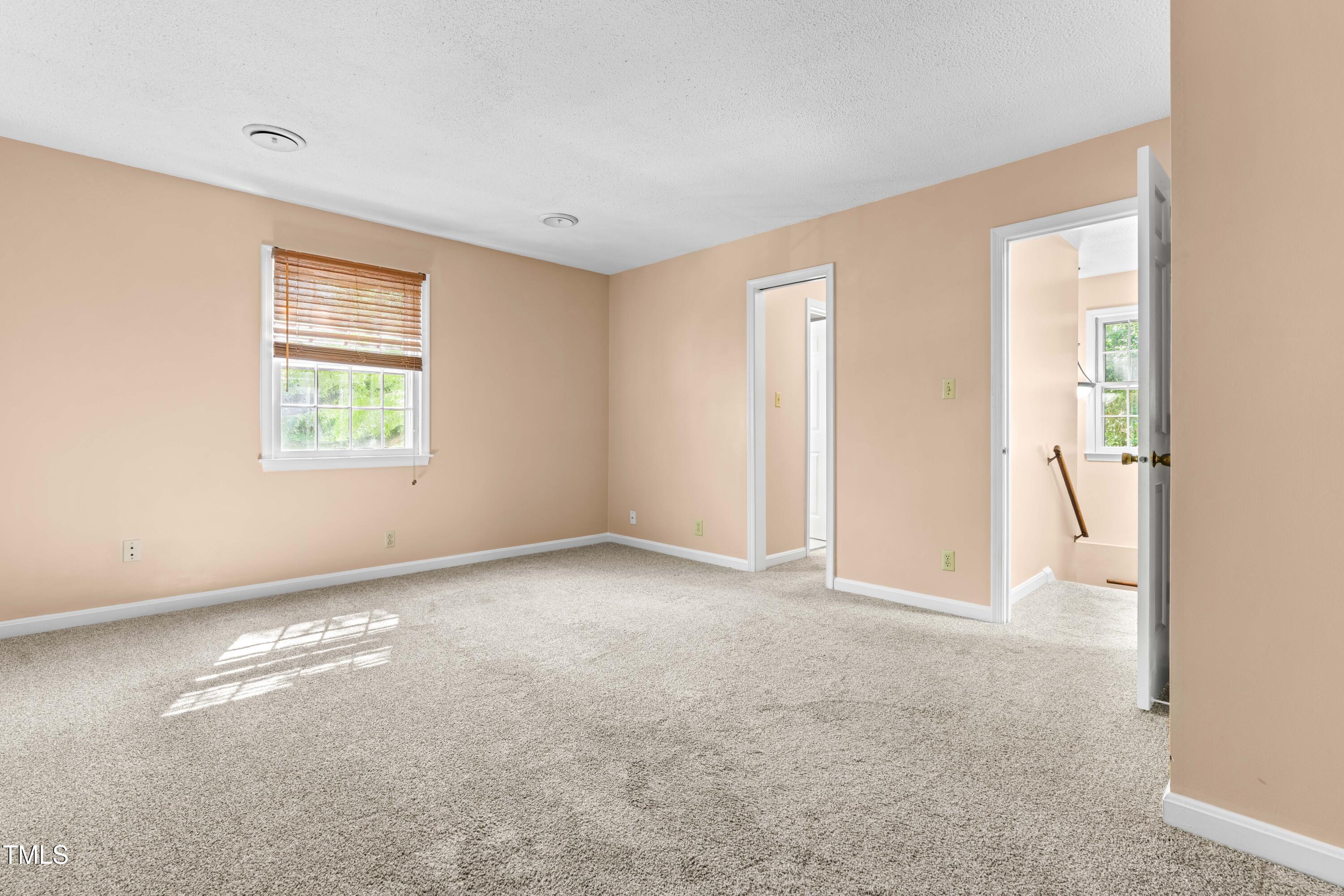 3029 Wycliff Road Raleigh, NC 27607 - Photo 18 of 35 an empty room with windows and closet