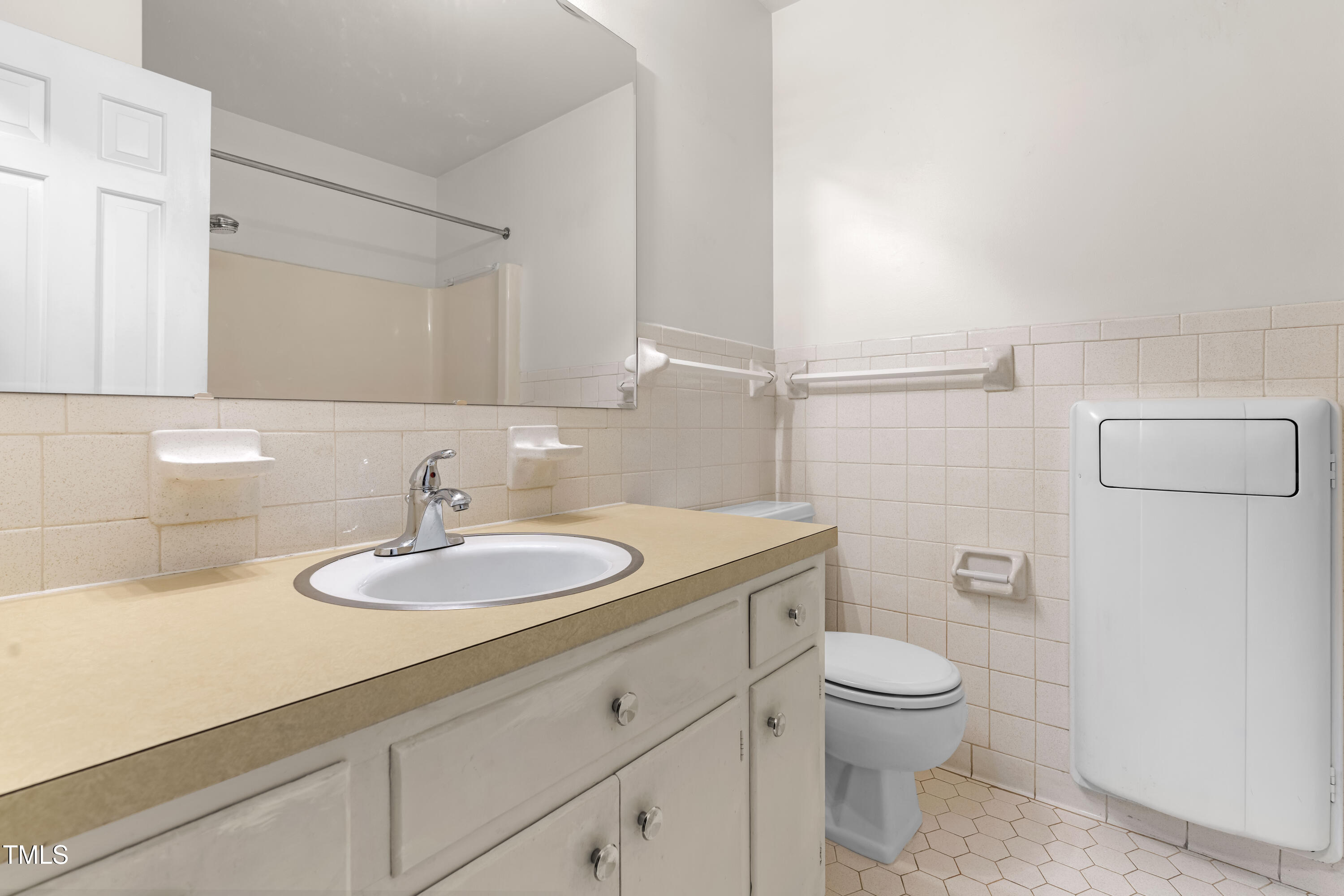 3029 Wycliff Road Raleigh, NC 27607 - Photo 21 of 35 a bathroom with a granite countertop toilet sink mirror and vanity