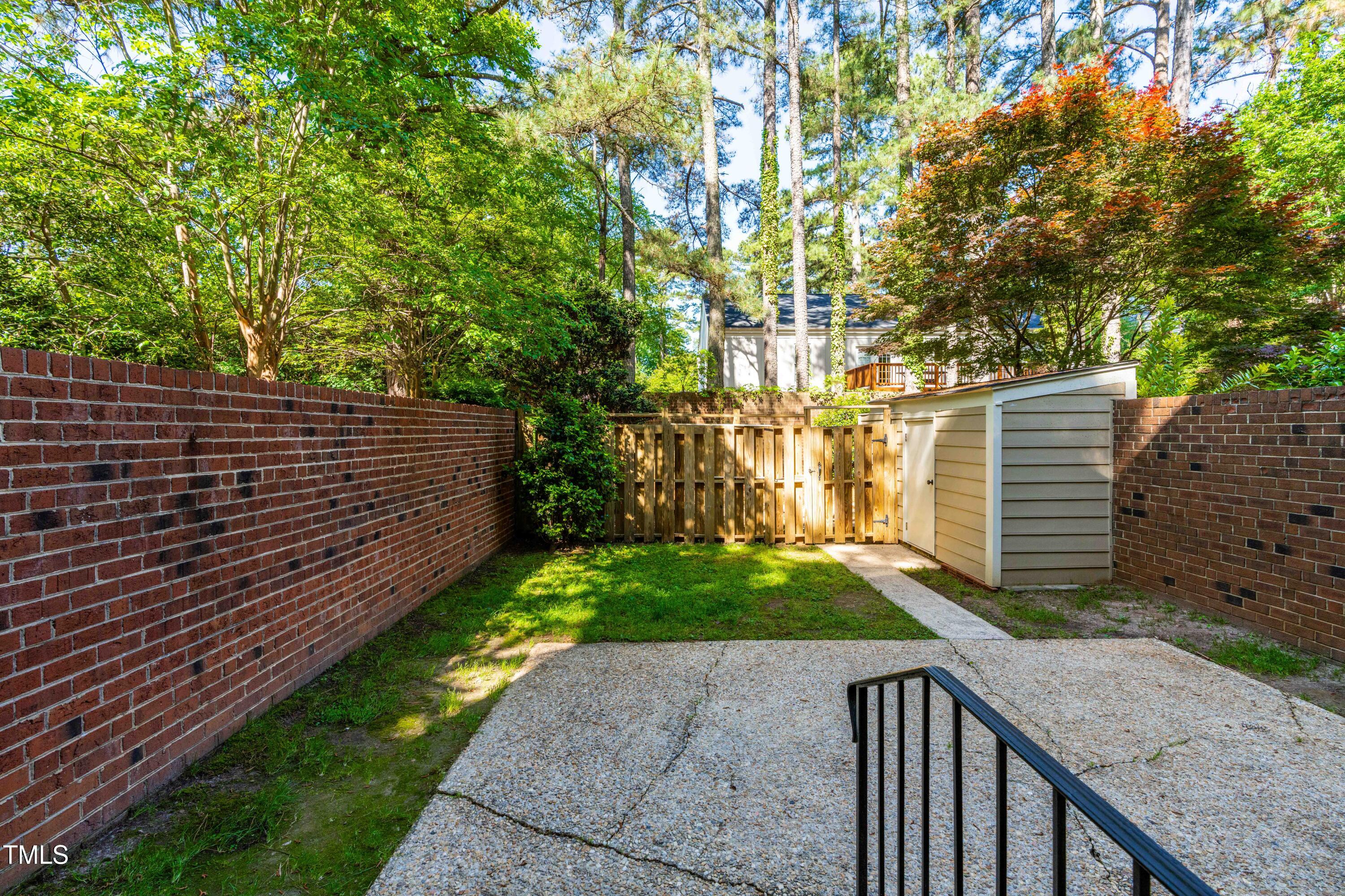 3029 Wycliff Road Raleigh, NC 27607 - Photo 27 of 35 a view of a backyard with wooden fence