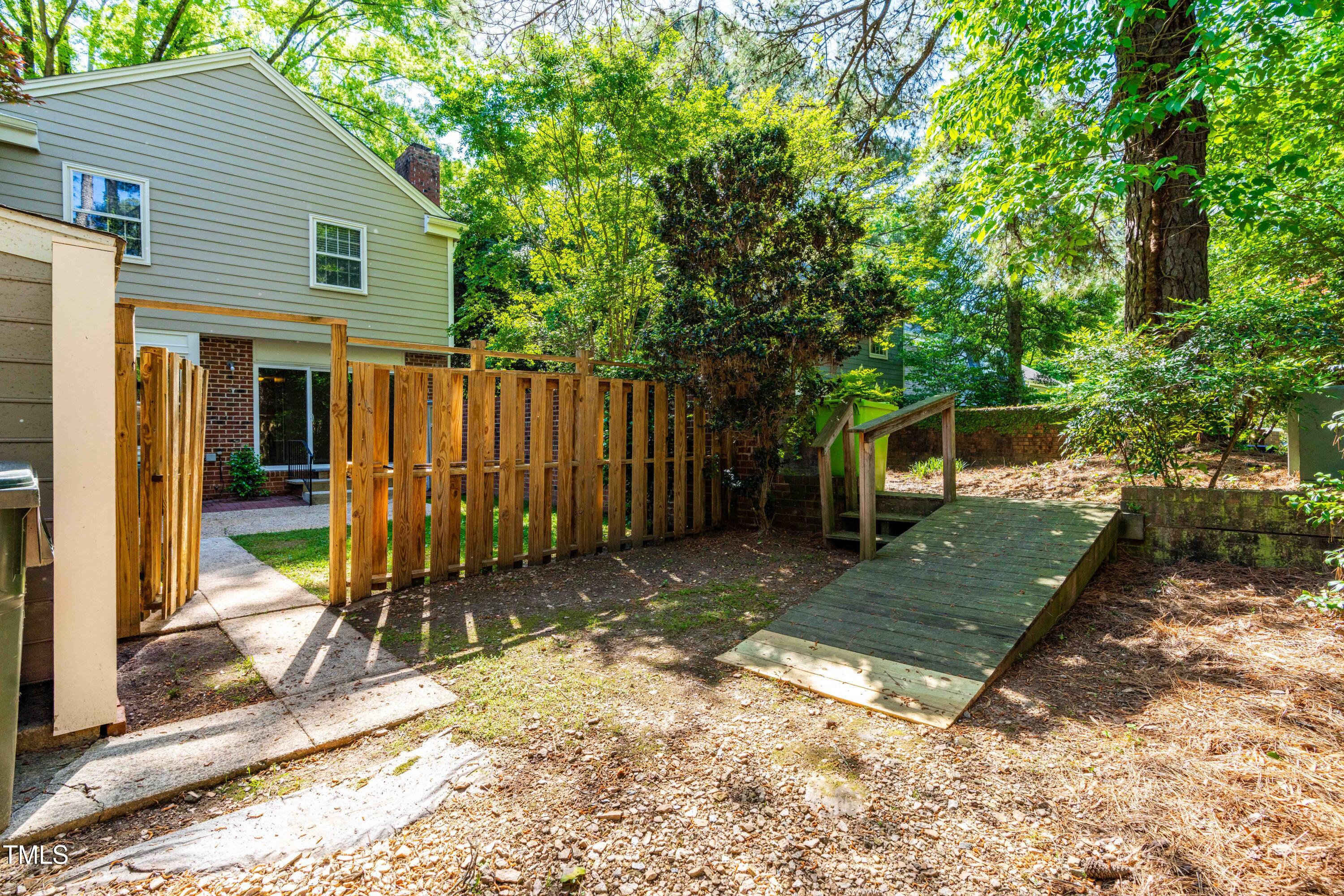 3029 Wycliff Road Raleigh, NC 27607 - Photo 31 of 35 a view of a backyard with a tree