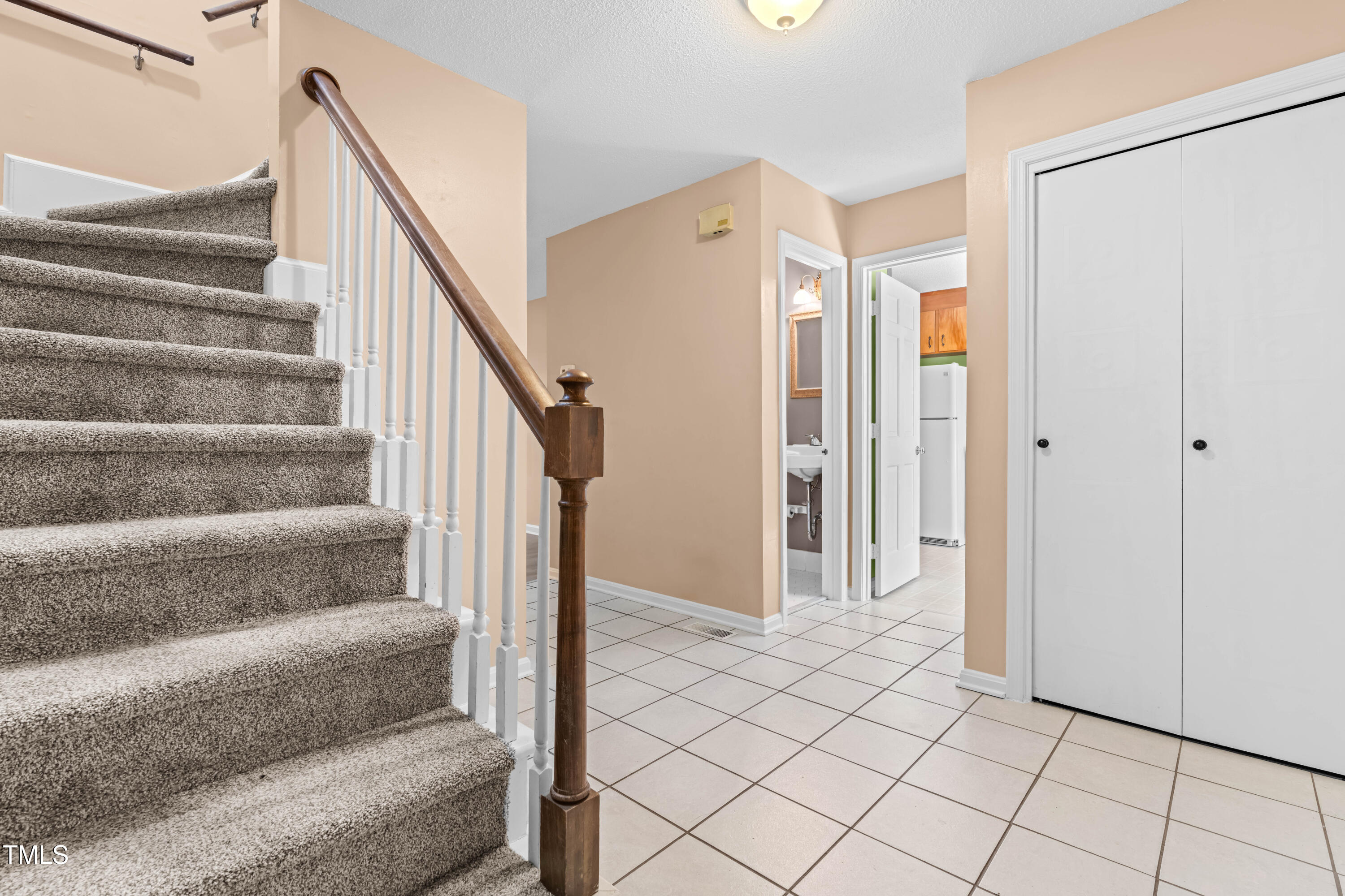 3029 Wycliff Road Raleigh, NC 27607 - Photo 4 of 35 a view of staircase with white walls and white walls
