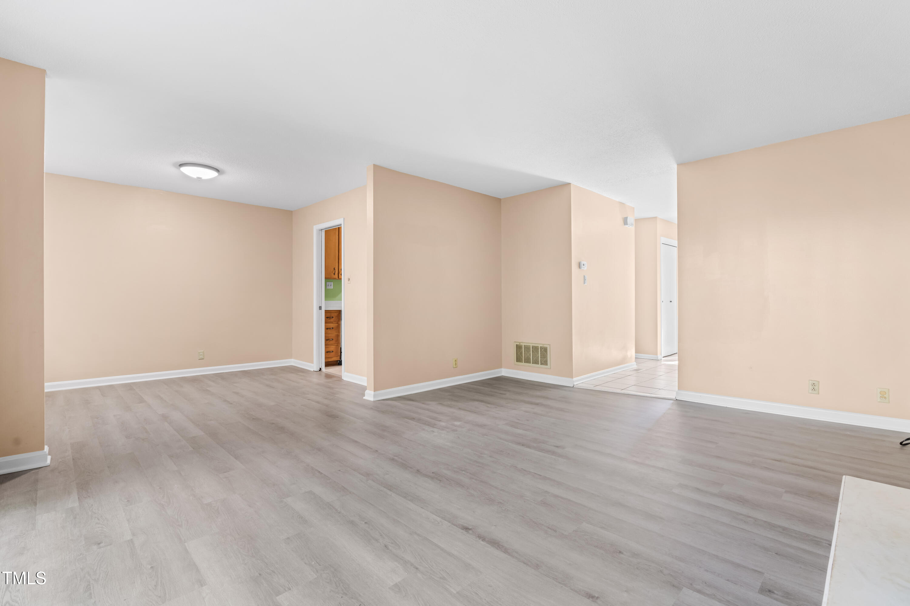 3029 Wycliff Road Raleigh, NC 27607 - Photo 10 of 35 a view of an empty room with wooden floor