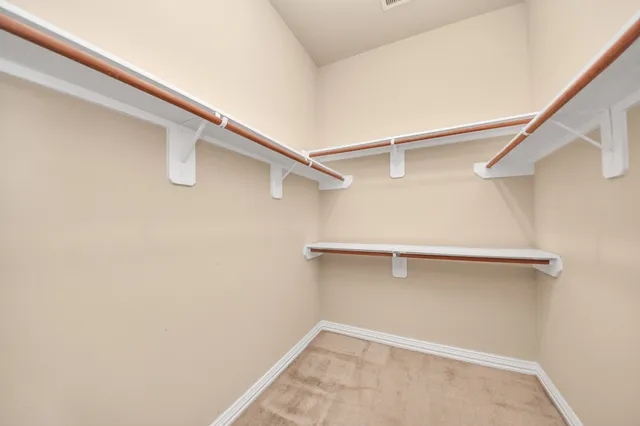 a view of an empty walk in closet