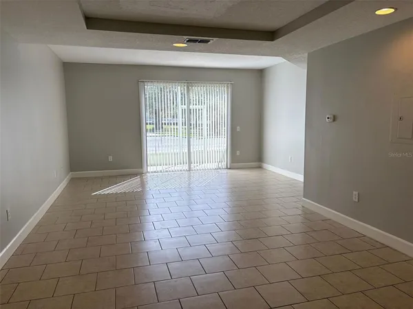 a view of an empty room and window