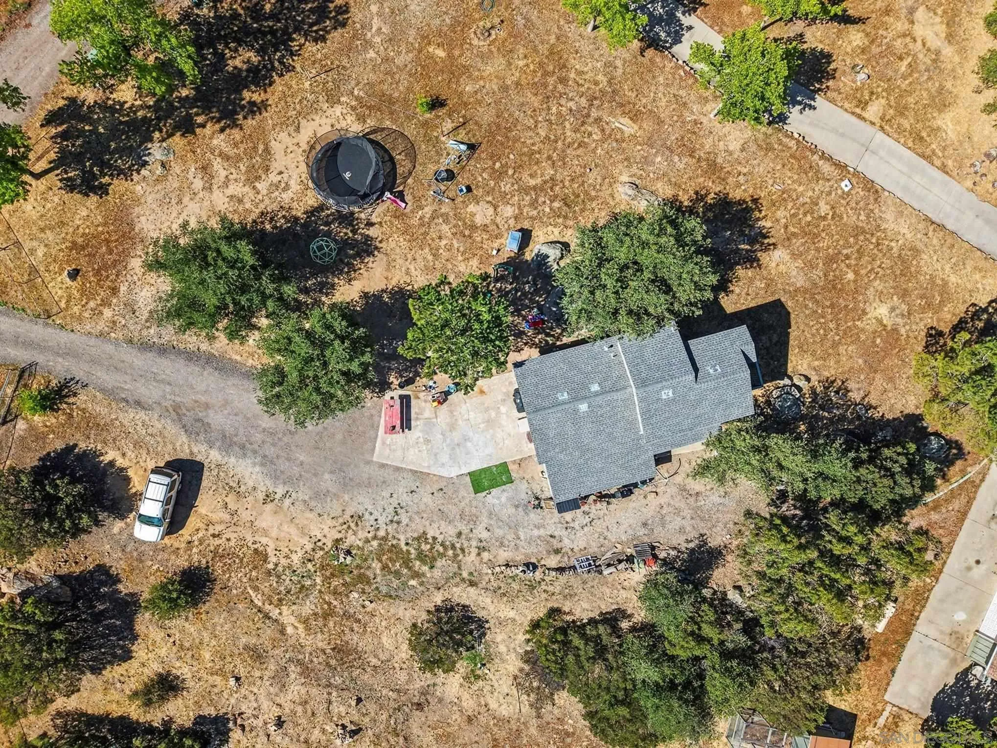 10442 Boulder Creek Road Descanso, CA 91916 - Photo 6 of 36 an aerial view of a house with a yard and a large tree