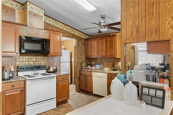 a kitchen with a stove cabinets and a sink