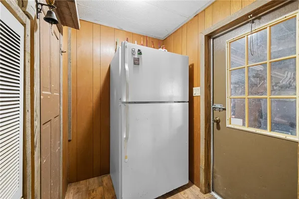 a view of a refrigerator in kitchen with a refrigerator