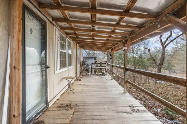 a view of balcony with wooden floor