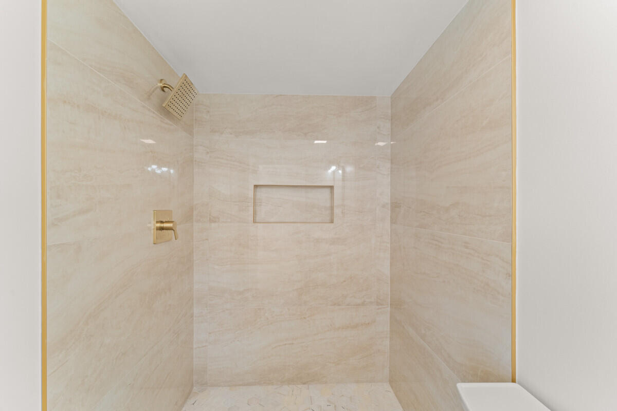 3797 Bahama Road Palm Beach Gardens, FL 33410 - Photo 11 of 33 a bathroom with a shower