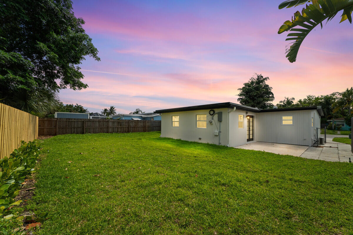3797 Bahama Road Palm Beach Gardens, FL 33410 - Photo 2 of 33 a view of a backyard with a house