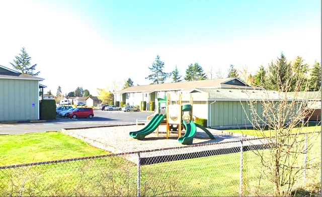 a view of swimming pool with a patio and a garden