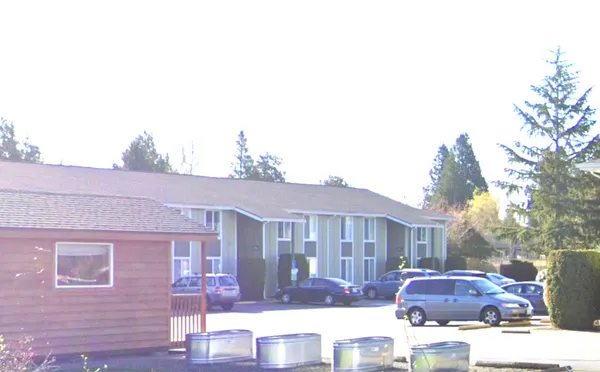 a front view of residential houses with street