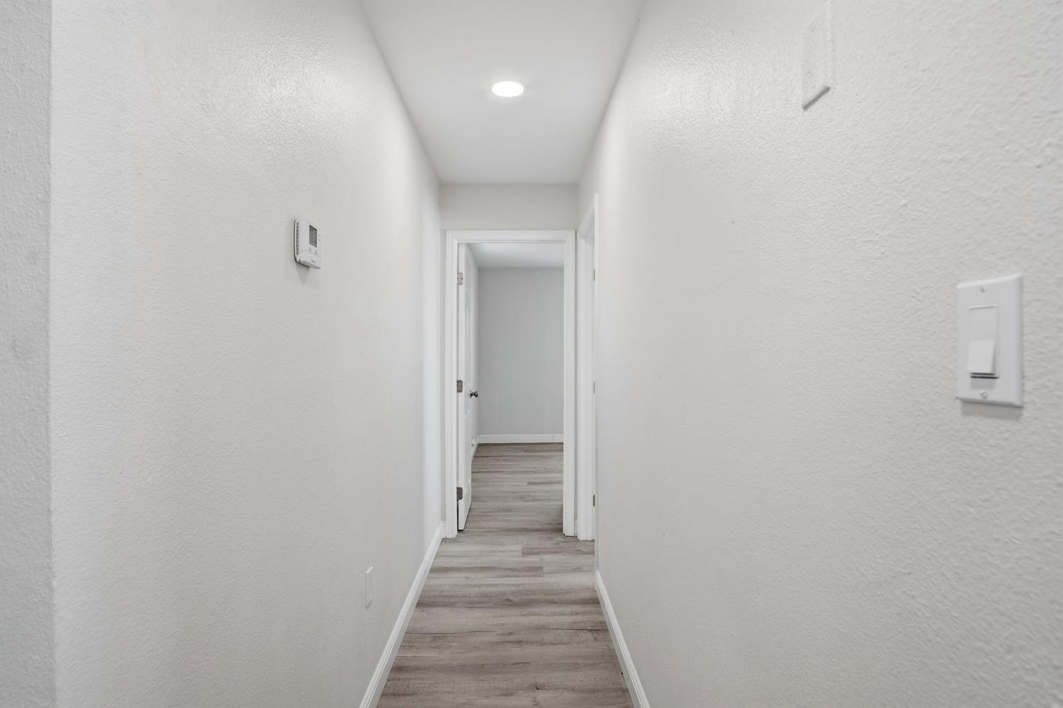 341 2nd Street Livingston, CA 95334 - Photo 15 of 19 a view of a hallway with wooden floor