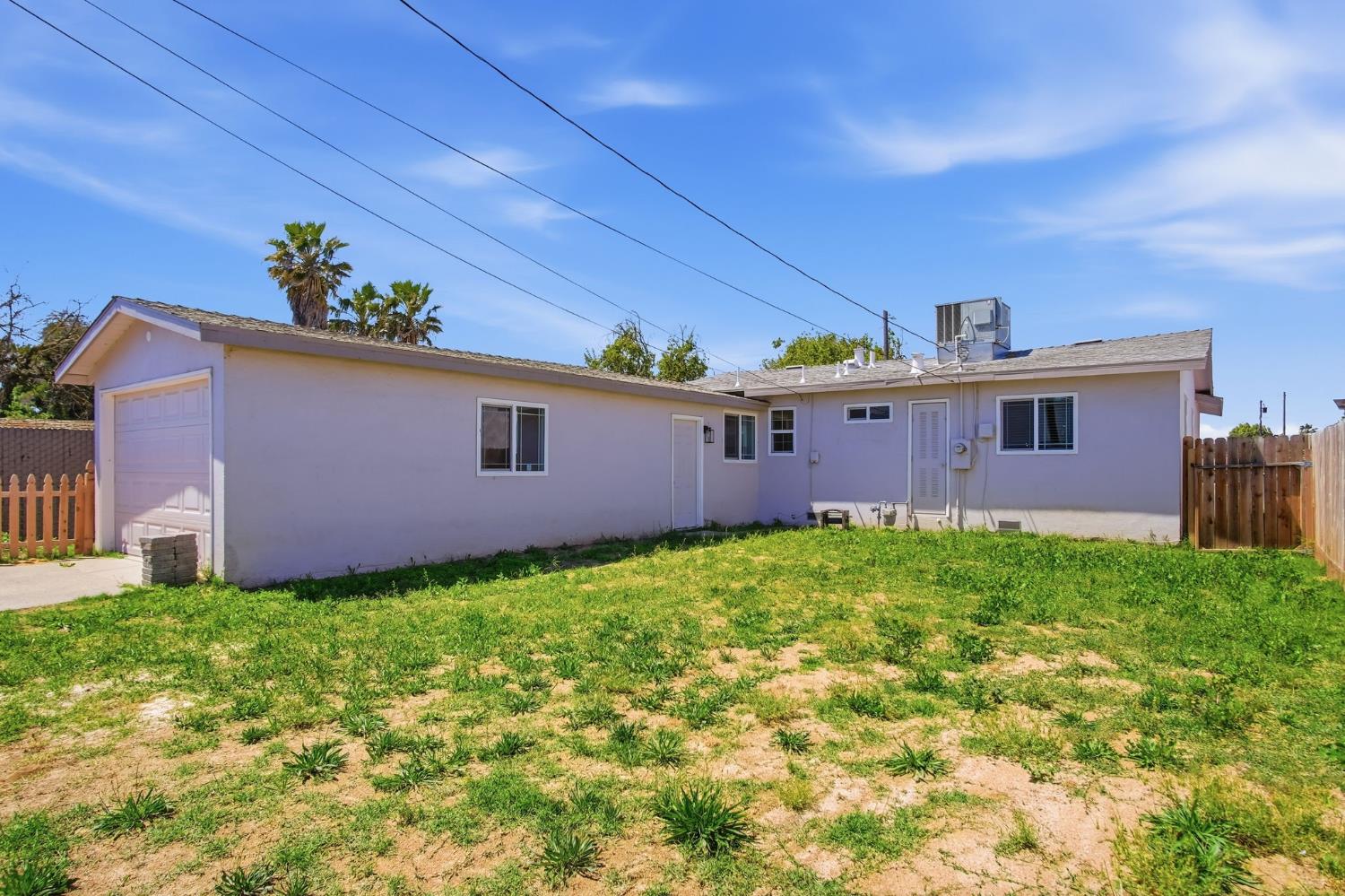341 2nd Street Livingston, CA 95334 - Photo 19 of 19 a view of a backyard with a garden