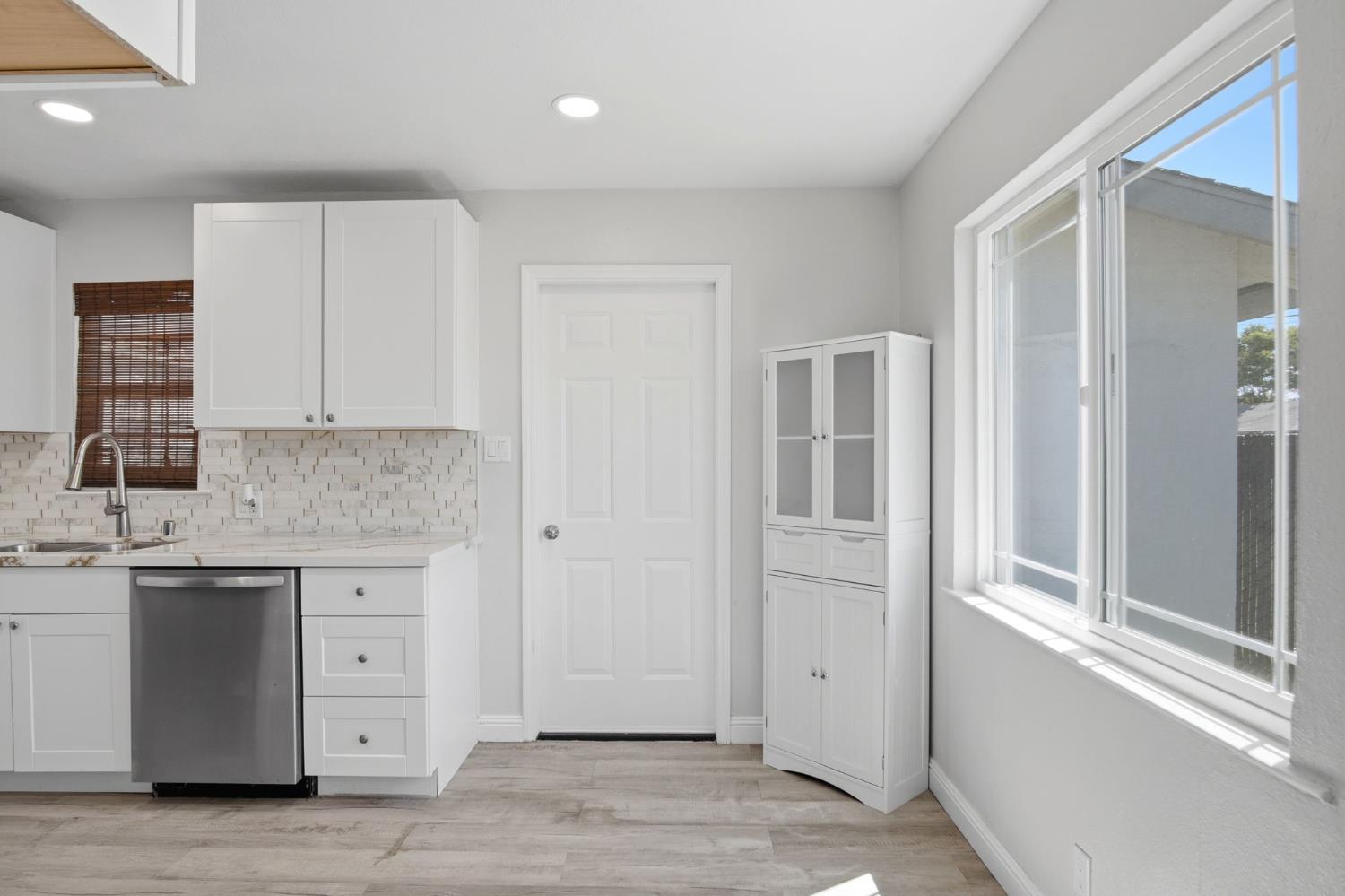 341 2nd Street Livingston, CA 95334 - Photo 7 of 19 a kitchen with a sink and cabinets