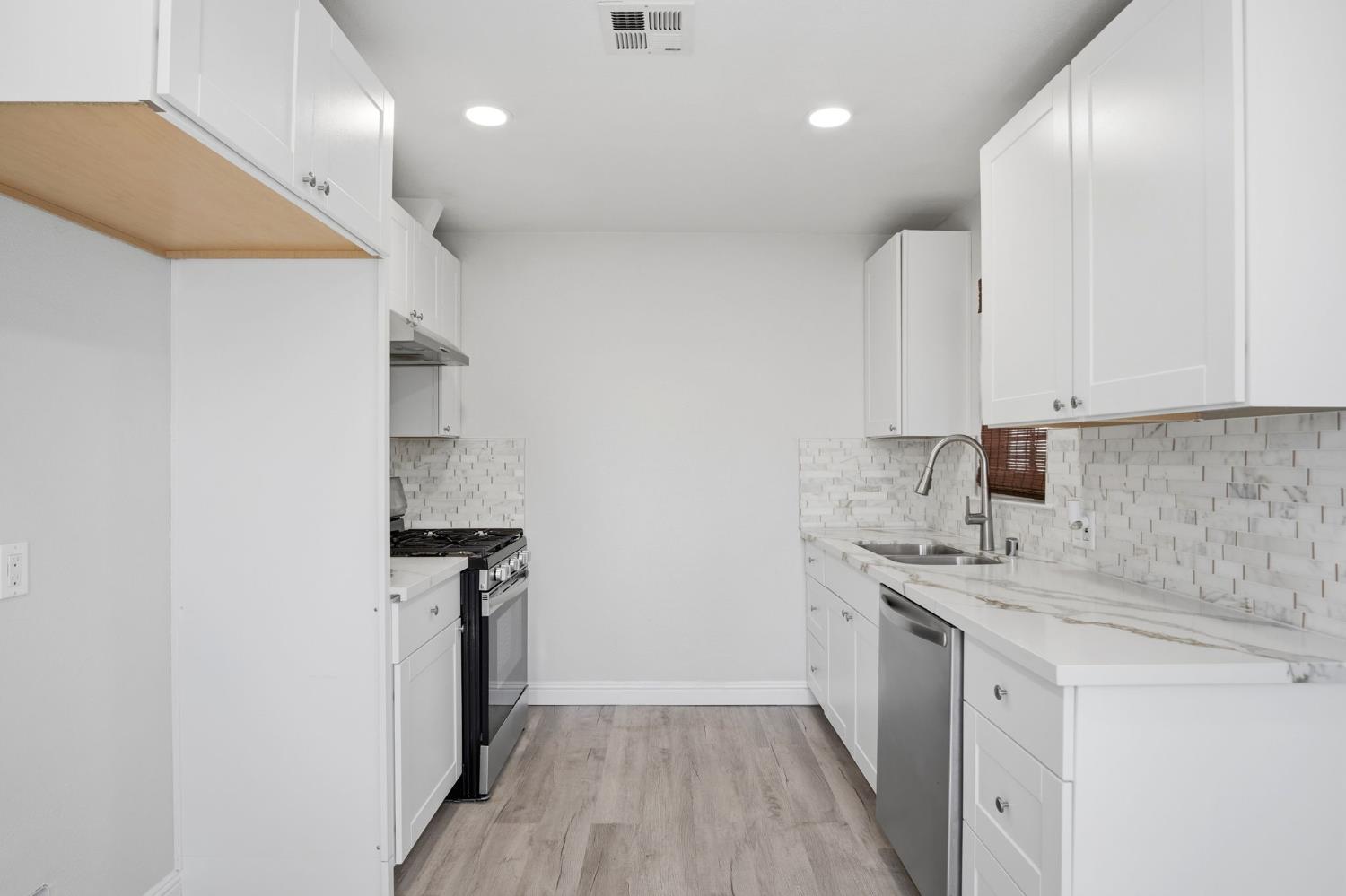 341 2nd Street Livingston, CA 95334 - Photo 8 of 19 a kitchen with a sink stainless steel appliances and cabinets