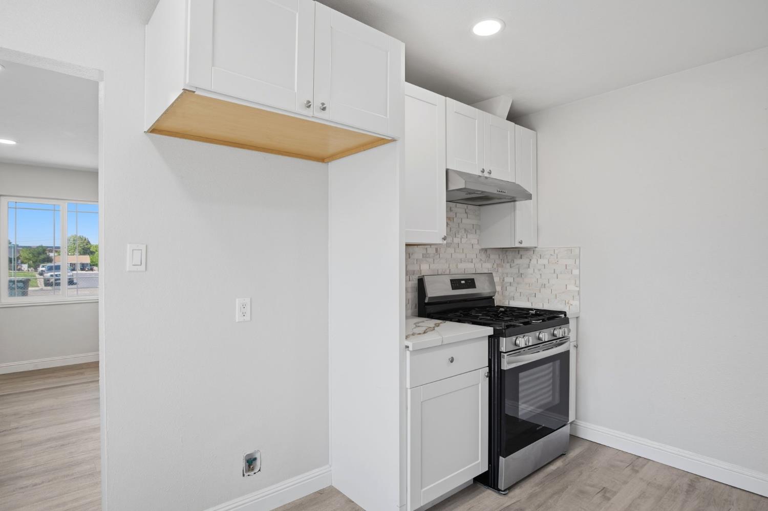 341 2nd Street Livingston, CA 95334 - Photo 9 of 19 a kitchen with stainless steel appliances a stove and a refrigerator