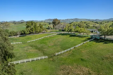 a view of a lake with a yard