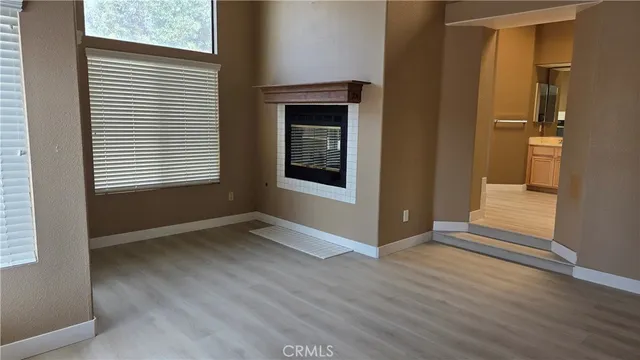 a spacious bathroom with a granite countertop sink and a mirror