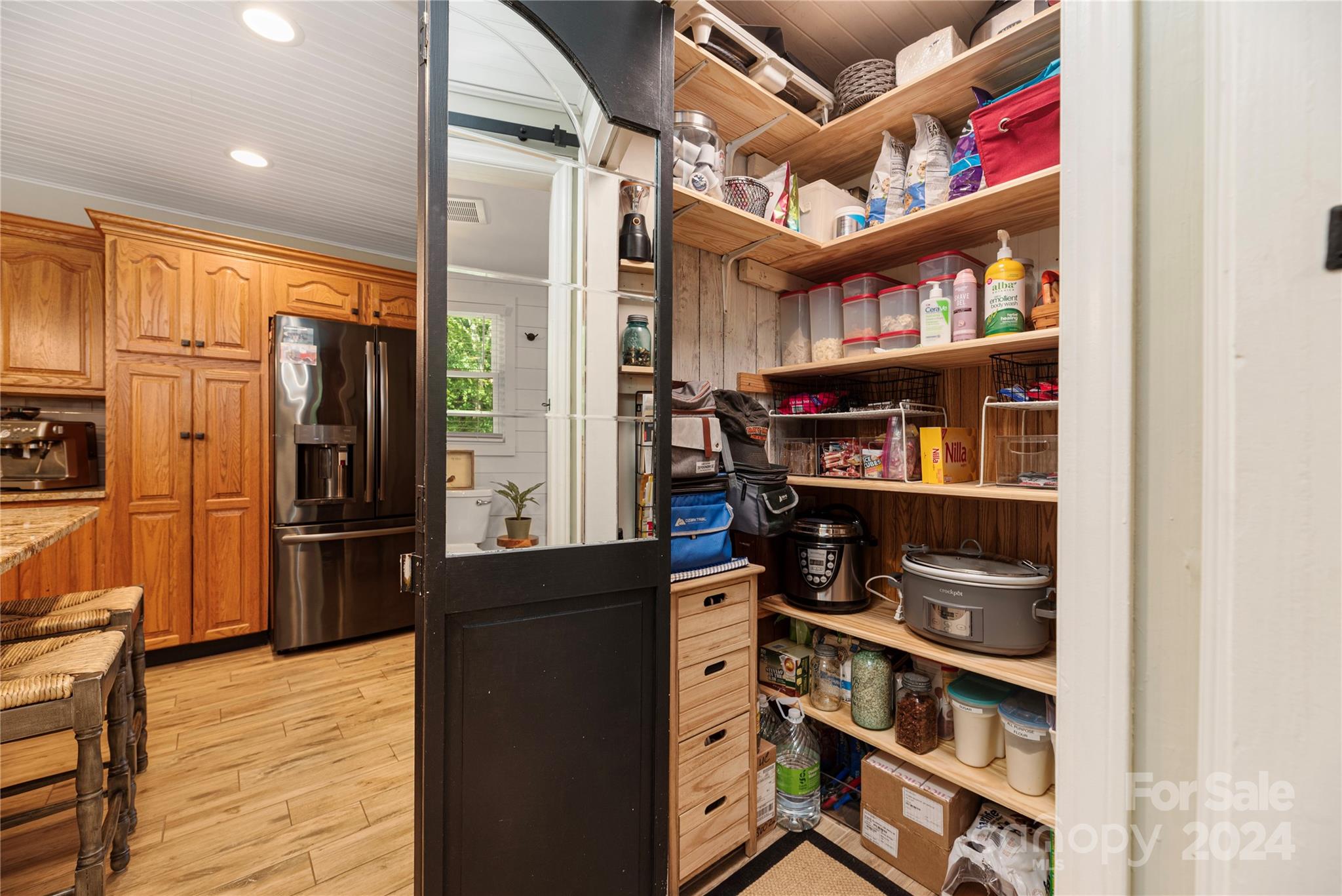 13002 Mayes Road Huntersville, NC 28078 - Photo 19 of 43 a view of a kitchen with cabinets and wooden floor