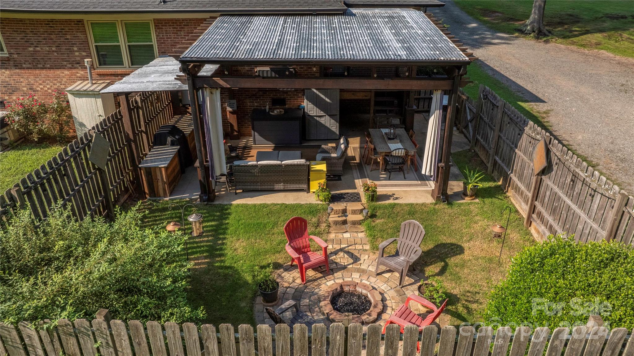 13002 Mayes Road Huntersville, NC 28078 - Photo 34 of 43 a view of a chairs and table in patio with a barbeque grill