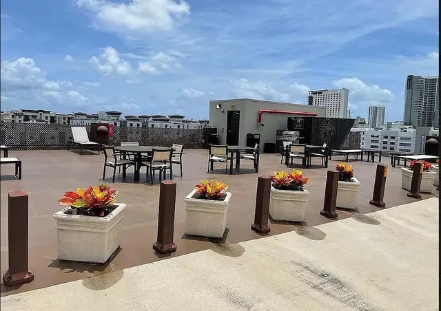 a outdoor living space with furniture and a potted plant
