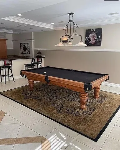 front view of a house with a yard and an fountain