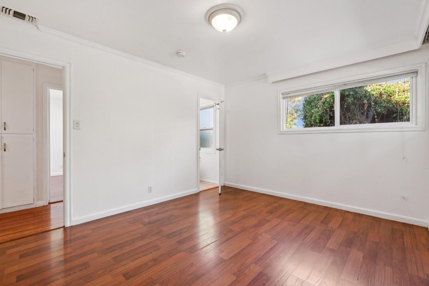3107 Windsor Place Concord, CA 94518 - Photo 11 of 21 an empty room with wooden floor and windows
