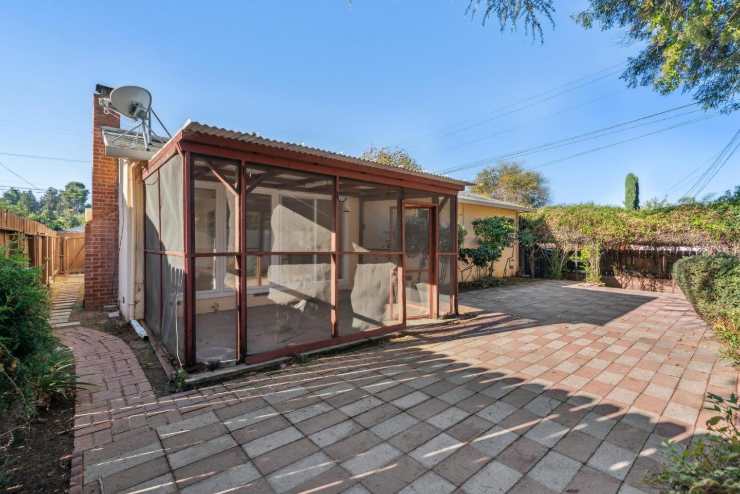 3107 Windsor Place Concord, CA 94518 - Photo 17 of 21 a view of a house with a small yard and a large tree