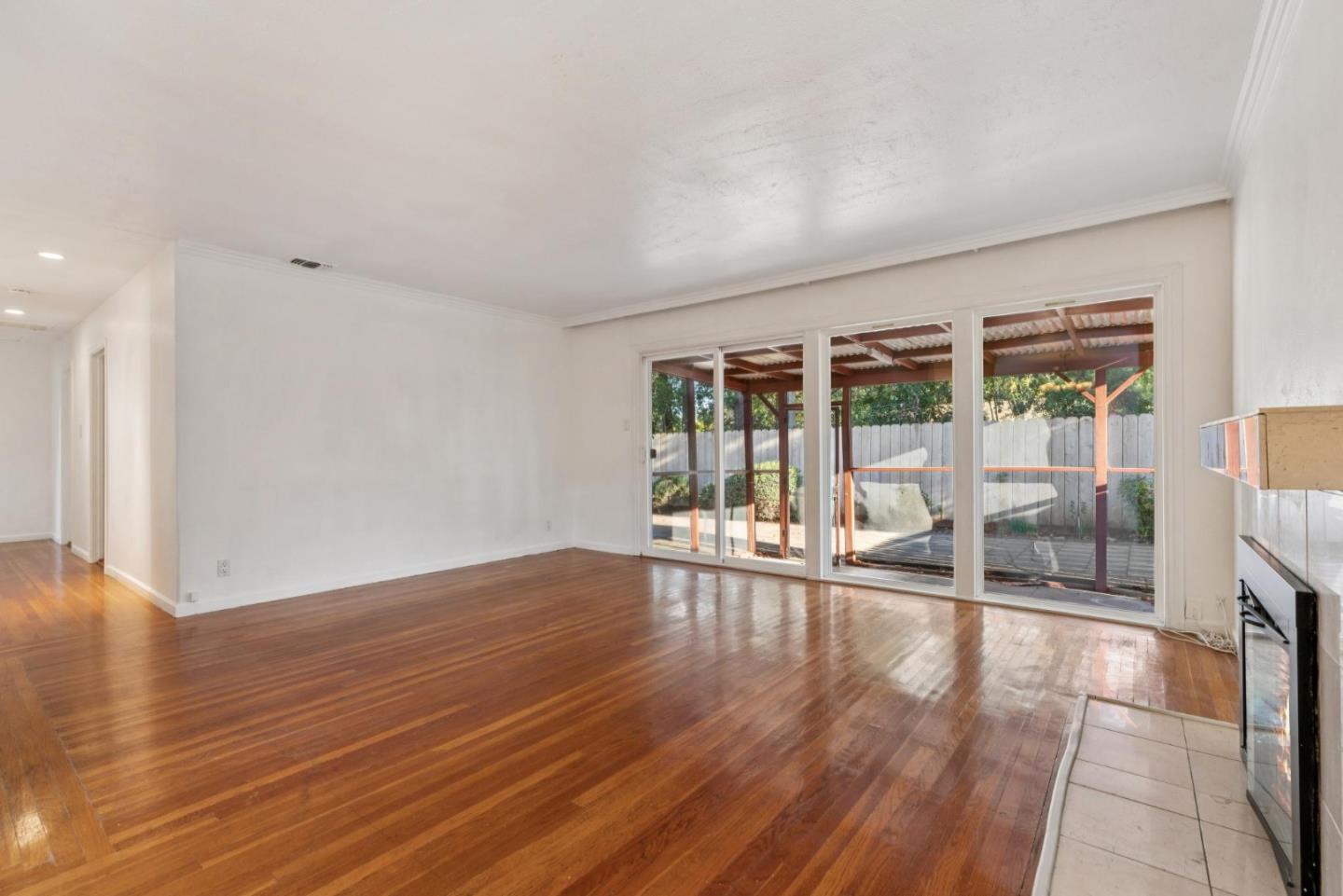 3107 Windsor Place Concord, CA 94518 - Photo 4 of 21 a view of an empty room with wooden floor and a window
