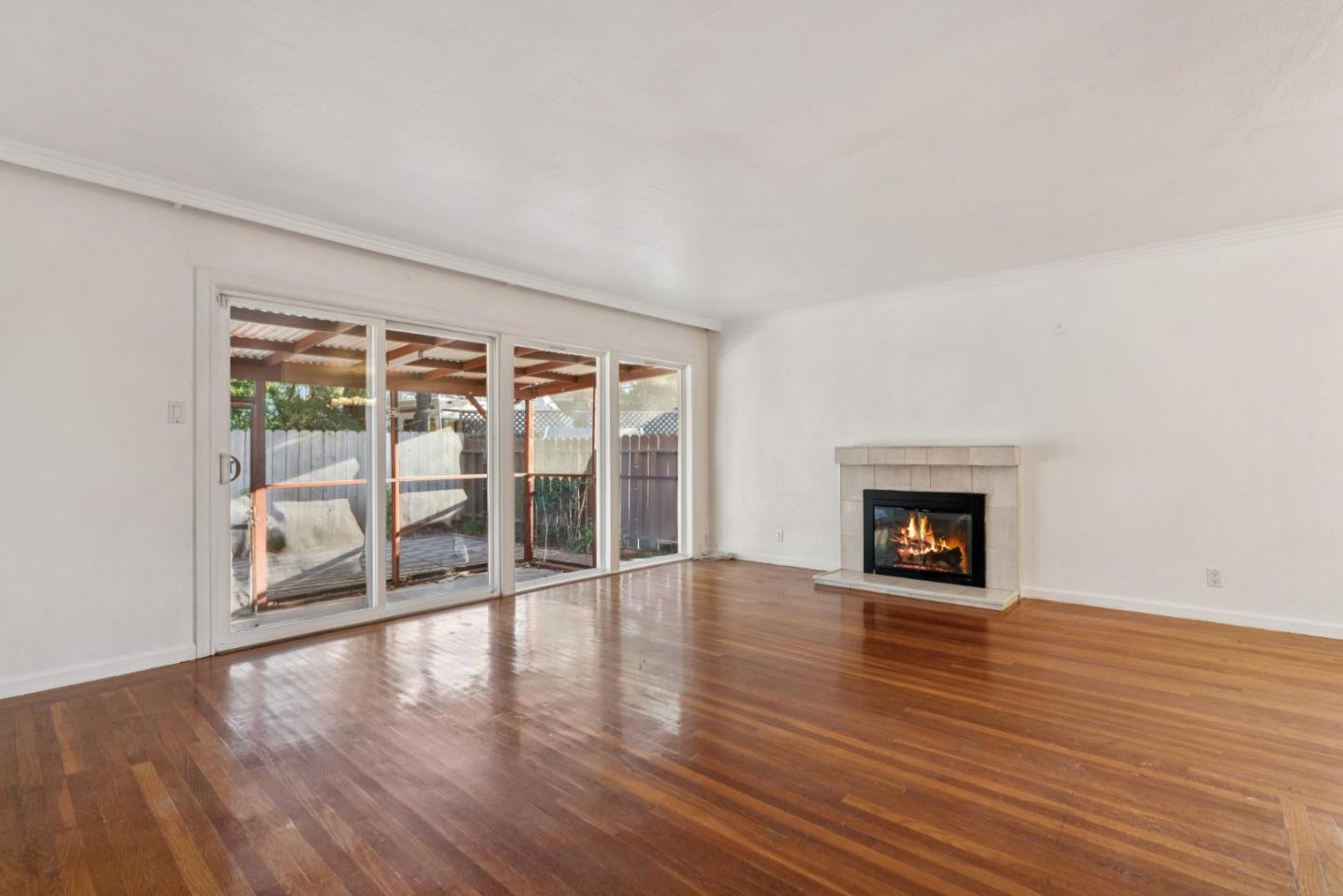 3107 Windsor Place Concord, CA 94518 - Photo 5 of 21 an empty room with wooden floor and fireplace