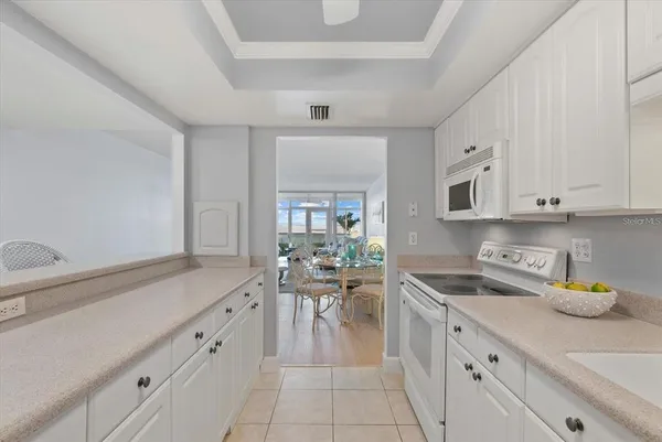 a kitchen with cabinets and window