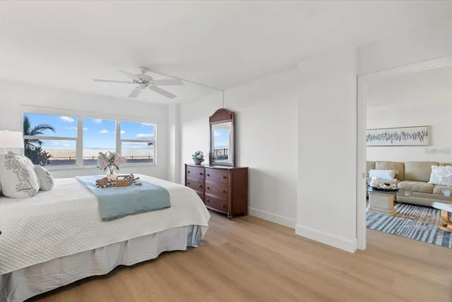 a bedroom with furniture and a wooden floor