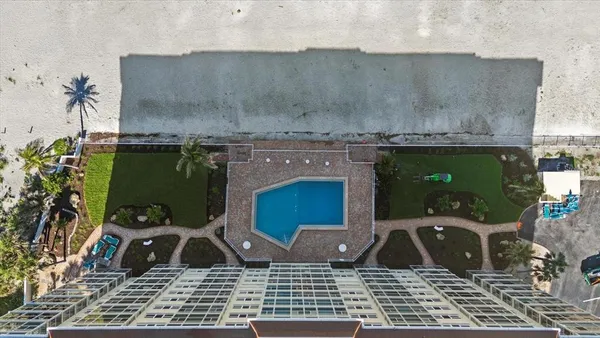 an aerial view of a house with a garden