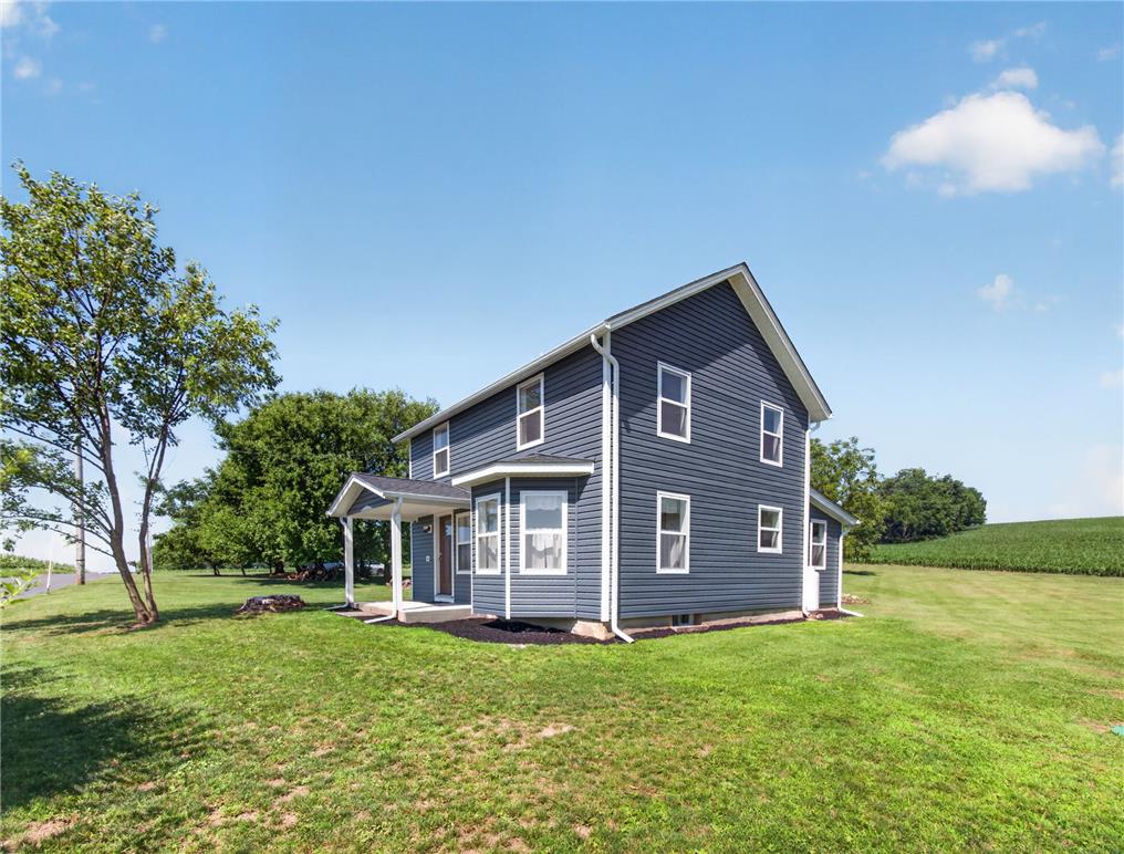 291 East Dannersville Road Bath, PA 18014 - Photo 7 of 46 A classic two-story home, freshly sided, stands amidst open green spaces and mature trees.