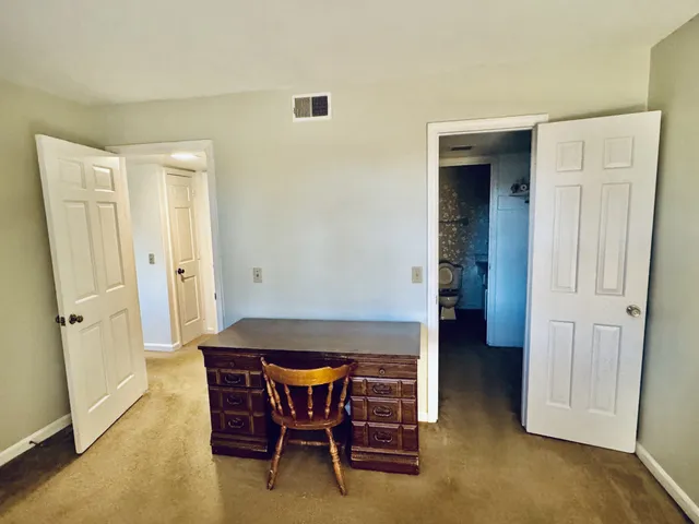 a view of dining room with furniture and wooden floor