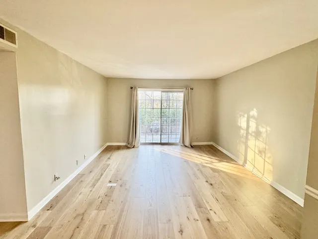 a view of an empty room and window