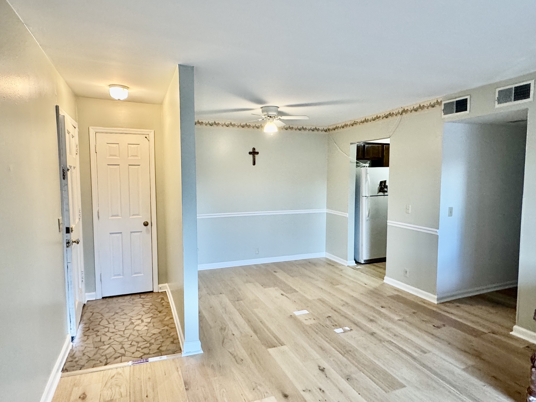 601 Boyd Mill Avenue, Unit M3 Franklin, TN 37064 - Photo 3 of 19 a view of a hallway with wooden floor and a cabinet