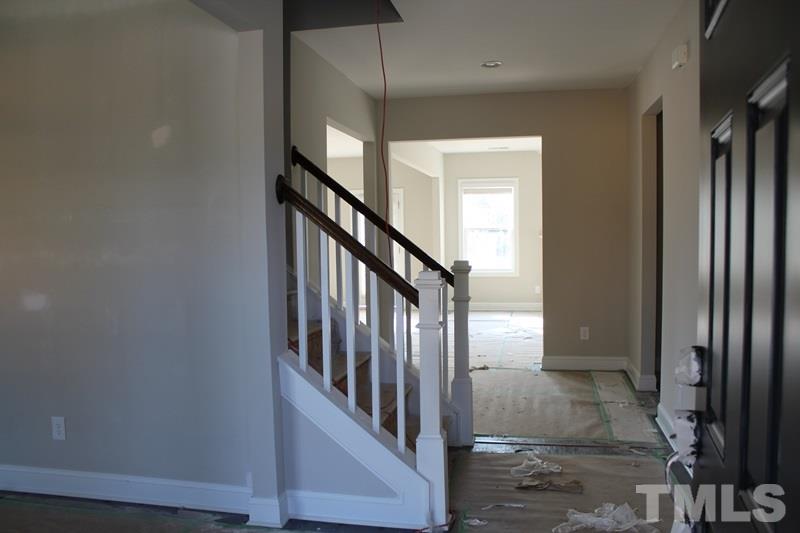 1116 Silver Farm Road Raleigh, NC 27603 - Photo 8 of 20 a view of staircase with lots of frames on wall and stairs
