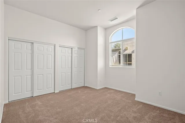 a kitchen with stainless steel appliances granite countertop a stove microwave and refrigerator