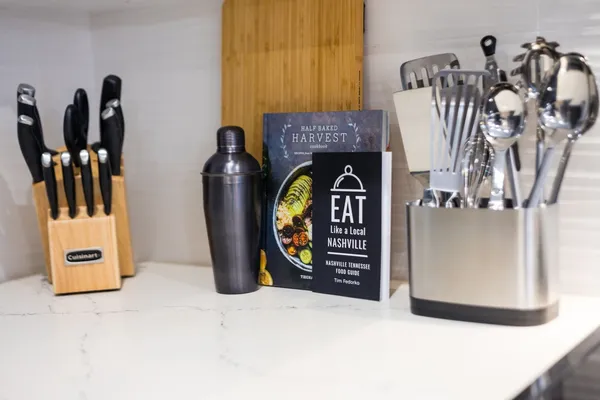 a kitchen with stainless steel appliances a sink cabinets and refrigerator