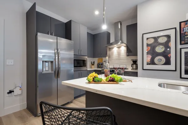 a kitchen with a sink stove and refrigerator