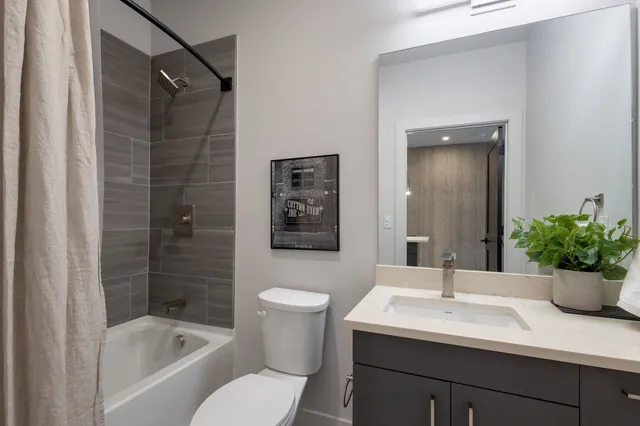 a view of a brick building with a bench in front of building