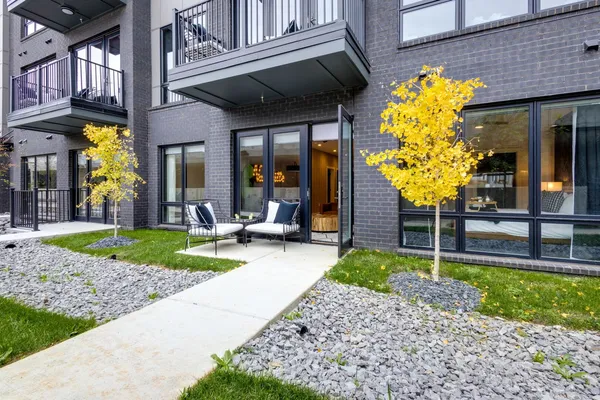 a view of a livingroom with furniture and a window