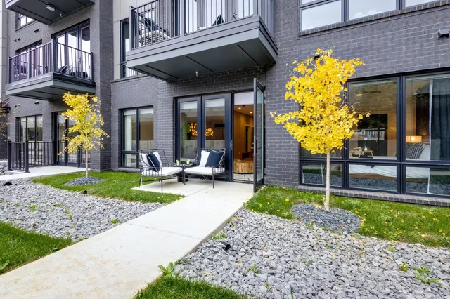 a view of a livingroom with furniture and a window