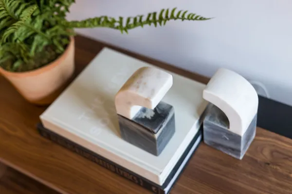 a living room with furniture kitchen and a table