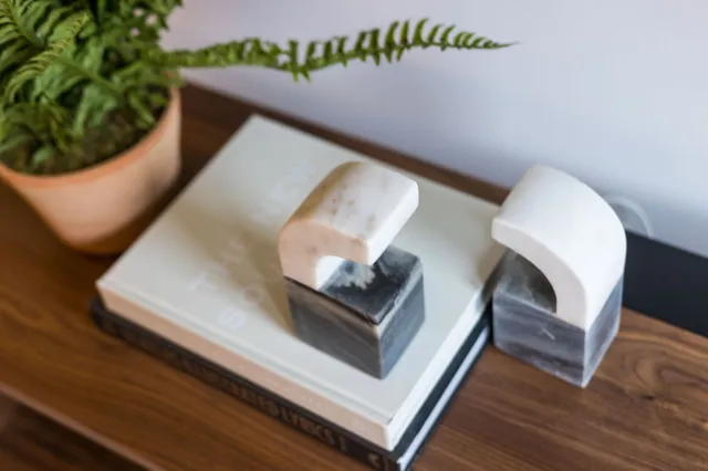 a living room with furniture kitchen and a table