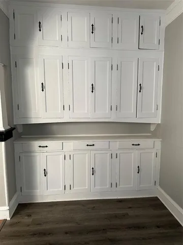 a view of white kitchen with white cabinets